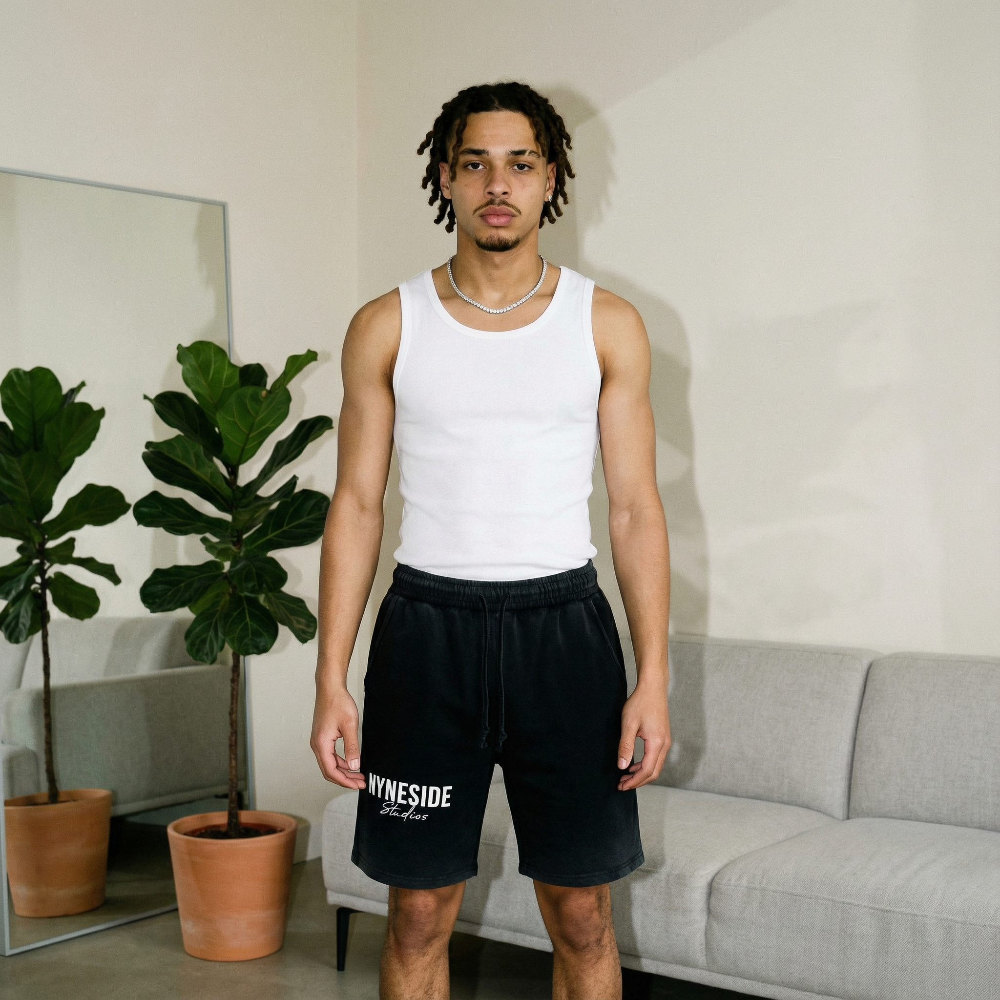 black Nyne Essentials shorts side view pockets and stitching Y2K streetwear Nyneside Studios