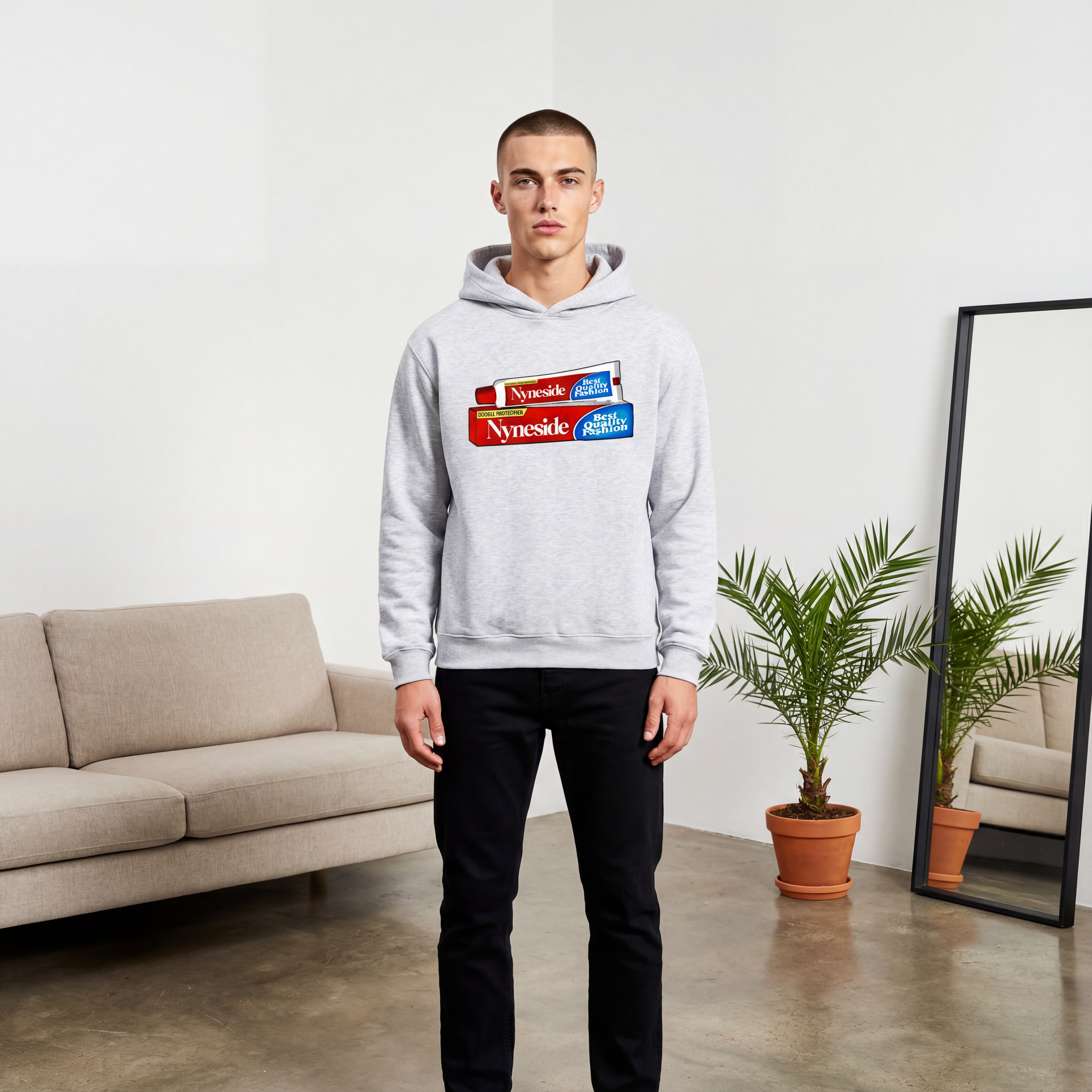 Nyne Shine hoodie by Nyneside Studios, men’s light grey graphic pullover hoodie styled in a modern minimalist studio.